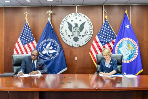 NCUA Chairman Rodney E. Hood and Export Import Bank President Kimberly A. Reed sign a memorandum of understanding. s MOU