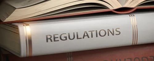Book with Regulations written on spine.