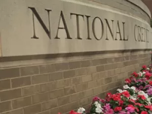 Exterior building stonework with 'National Credit Union Administration' etched